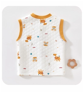 Detail of baby quilted vest featuring desert theme camel prints and orange ribbed edges