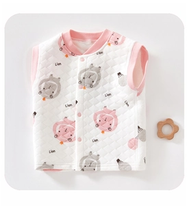 Detail of baby quilted vest featuring cartoon lion patterns and ribbed pink collar trim