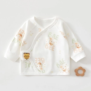 Detail of newborn baby cotton kimono top with cute bee pattern and 3D applique buckle