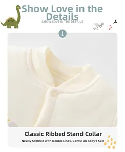 Close-up of beige infant romper showing ribbed stand collar and snap button detail