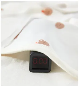 Detail showing non-toxic cotton baby romper fabric with zero formaldehyde test result