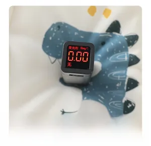 Digital fluorescent agent detector testing baby fabric with dinosaur print in macro view