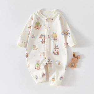 Flat lay of cotton infant romper with fairy tale prints and snap button closure