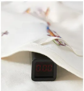 Detail of baby cotton fabric showing zero fluorescence test and butterfly pattern
