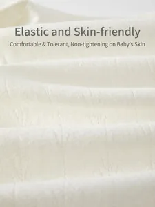 Macro detail of breathable white cotton knit fabric for newborn baby jumpsuits