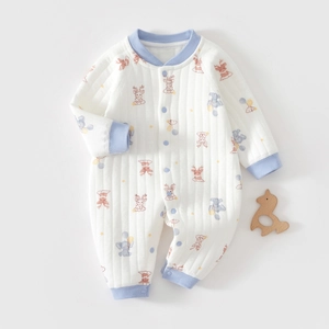 Detailed view of baby quilted cotton romper with elephant and deer cartoon prints
