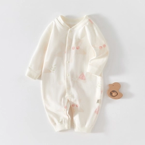Detailed view of baby long-sleeve cotton romper with pink cherry and watermelon prints