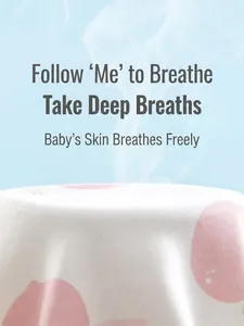 Breathable cotton baby bodysuit with peach print showing airflow on blue background