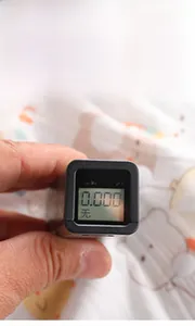 Testing baby romper for fluorescence with professional meter to ensure infant safety