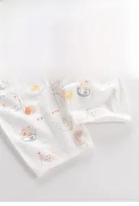 Detail of infant romper crotch featuring breathable cotton fabric and resin snap buttons