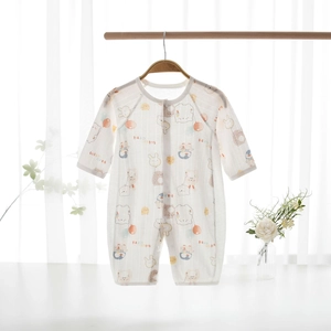 Detail of baby summer romper with cartoon animals on breathable mesh cotton fabric