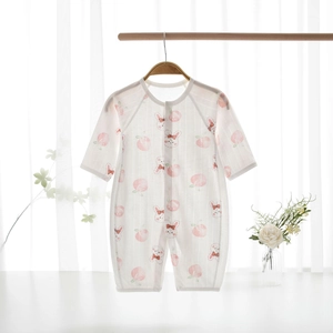 Close-up of baby romper featuring breathable mesh fabric with peach and bunny prints