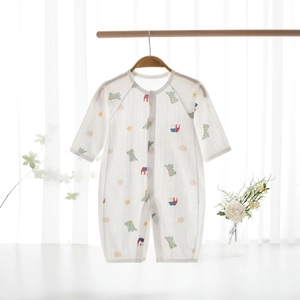 Close-up of baby dinosaur romper with breathable texture and front button closure