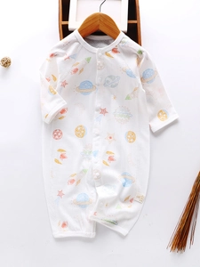 Baby white long sleeve romper with colorful space rocket print and wooden hanger