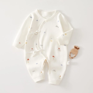 Detail of soft cotton newborn romper featuring colorful hot air balloon print and side ties