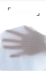 Close-up of white breathable cotton fabric showing fine mesh texture and lightweight feel