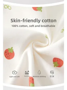 Close-up of soft breathable 100% cotton fabric with cute red strawberry patterns for baby rompers