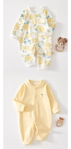 Close-up of soft cotton baby rompers with lemon print and side-seam fabric care labels