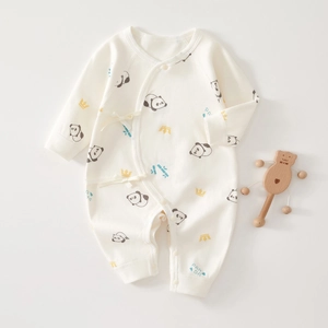 Detail of soft cotton baby romper with panda crown print and side snap closure