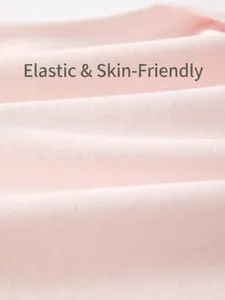 Close-up of baby romper soft pink knit cotton fabric showing texture and elasticity