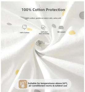 Détail du tissu 100% coton 40s pour bodies bébé avec des pois jaunes et gris sur fond blanc