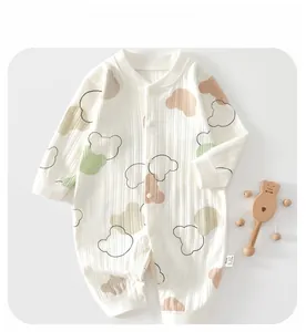 Detail of baby organic cotton romper featuring ribbed texture and bear patterns