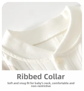Macro shot of ribbed cotton baby romper with soft bound neckline and snap button detail