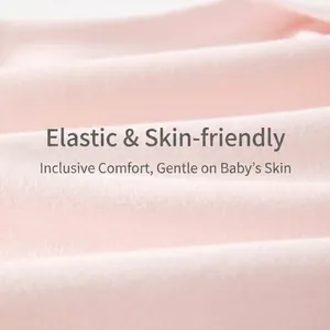 Close-up of soft pink cotton knit baby romper fabric showing breathable texture and comfort