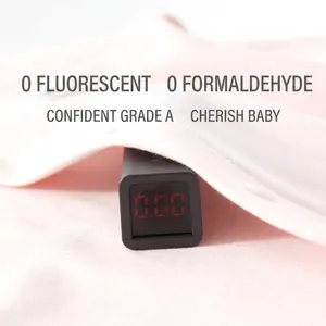 Pink organic cotton baby romper with A-grade safety test showing zero formaldehyde