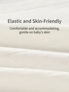 Soft off-white knitted baby romper with breathable hollow dot texture and stripe pattern