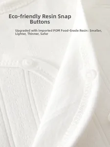 Detail of eco-friendly POM resin snap buttons on soft cotton newborn bodysuit