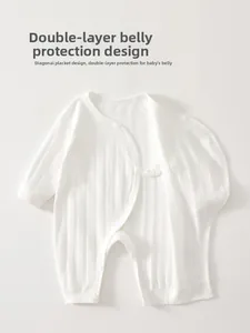 Detail view of cotton baby bodysuit with double-layer belly protection design