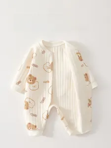 Close-up of baby romper with cute bear print and snap buttons for easy dressing