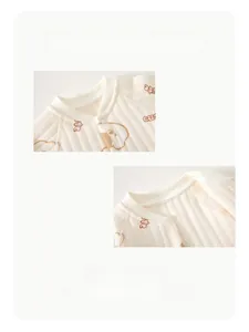 Close-up of baby quilted bodysuit with teddy bear prints and soft ribbed round neckline