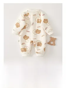Detailed macro view of padded baby romper with cute bear print and soft quilted texture