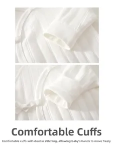 Detail of baby cotton bodysuit featuring reinforced double-stitched cuffs and ribbed fabric