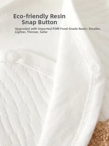 Detail of eco-friendly POM resin snaps on soft ribbed cotton newborn baby clothing