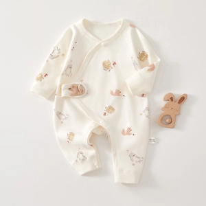 Detailed view of 100% cotton newborn romper featuring cute rabbit and forest animal prints