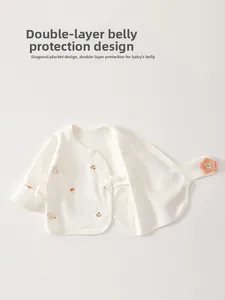 Detail of newborn cotton kimono top with double-layer belly protection and bear prints