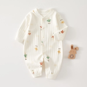 Detail of baby cotton romper featuring cartoon rabbit print and ribbed texture fabric