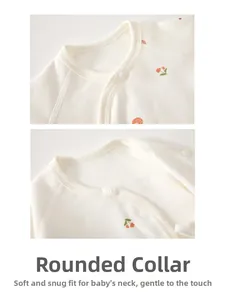 Detailed view of the soft cotton newborn wrap top featuring a floral print and bound neckline
