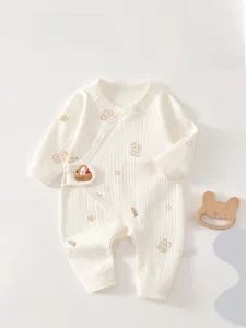 Detail of newborn cotton bodysuit featuring bunny prints and 3D plush rabbit decoration