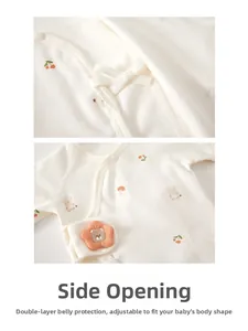 Detail of newborn cotton baby shirt showing ties and protective belly layer design