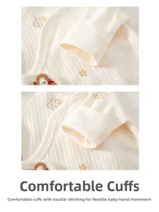Detail of comfortable baby romper cuffs with double stitching and star bear embroidery