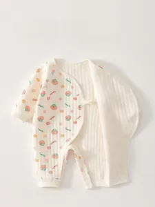 Detail of baby thermal romper with tomato print and safe tie closure for newborns