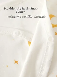 Close-up of eco-friendly POM resin snap buttons on cotton newborn baby romper