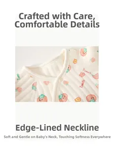 Detailed macro view of ivory cotton baby romper neckline with strawberry tomato print