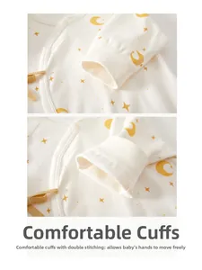 Detail of baby onesie sleeve with moon pattern, soft ribbed cuffs and double stitching