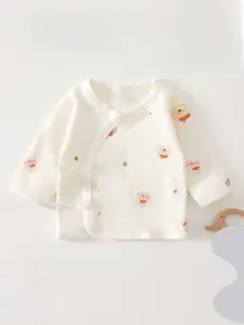 Detail of newborn cotton wrap top with cute bear and rabbit prints and side tie closure