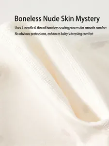 Soft white organic cotton baby undershirt featuring seamless bone-free sewing technology